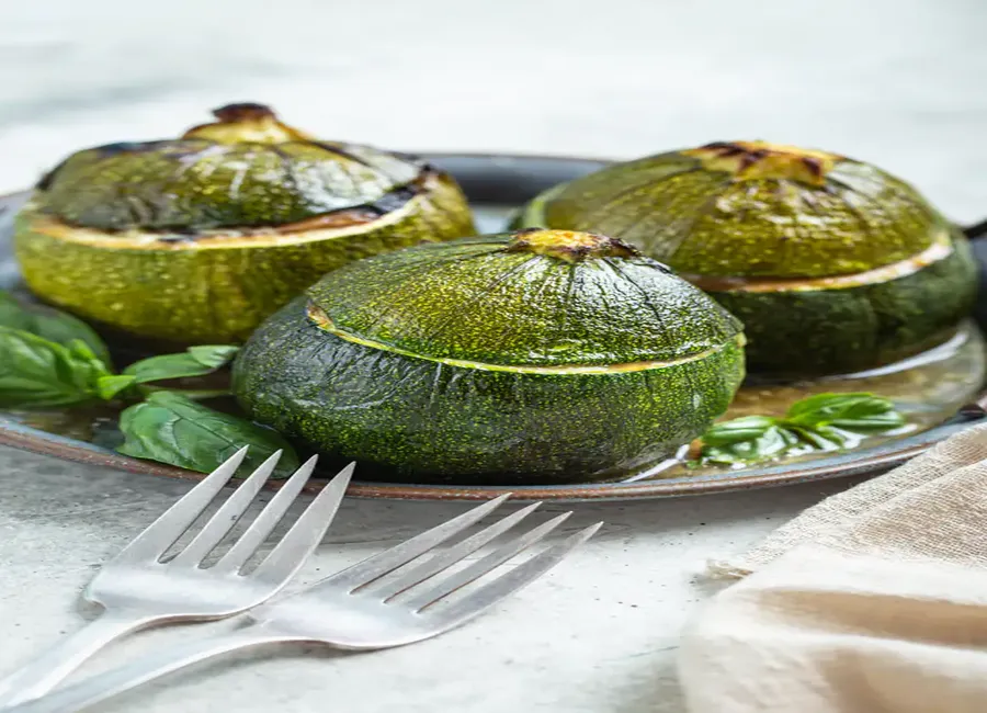 Courgettes farcies aux tomates et poivrons
