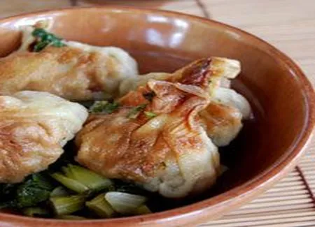 Raviolos poêlés de porc et canard, bok choy et glace de viande