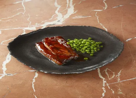 Tendrons de veau cuisinés au tandoori, petits pois à la sarriette de cyril lignac