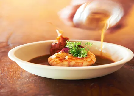 Langoustine royale poêlée sur une tranche de fenouil étuvé