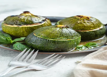 Courgettes farcies aux tomates et poivrons
