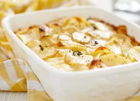 Gratin de pommes de terres à la creme fraiche et fromage fondu
