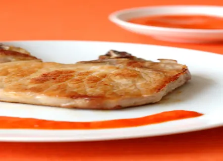Côte de porc au vin blanc et aux poivrons