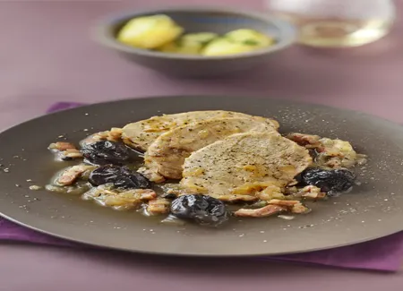 Porc aux pruneaux à la purée d'oignons